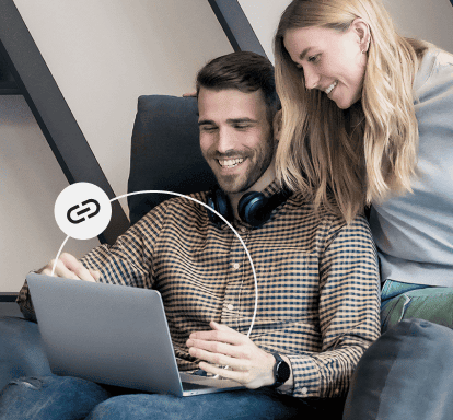 man and woman looking at laptop