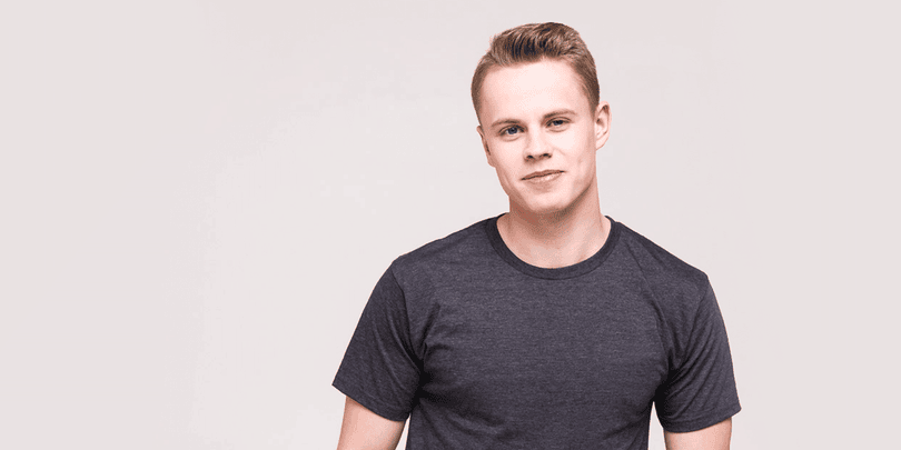 a man wearing a grey t-shirt