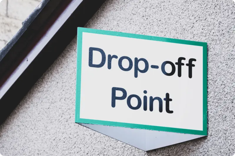 Waste drop-off point sign on the wall