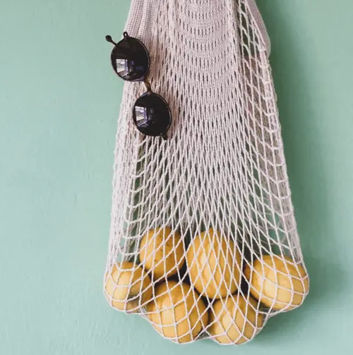 Crochet bag filled with oranges