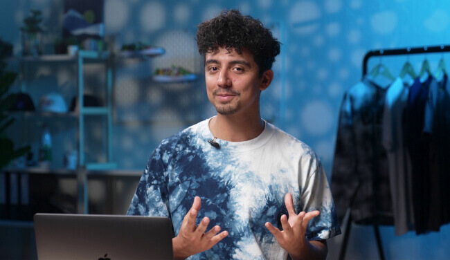 a person sitting at a desk with a laptop
